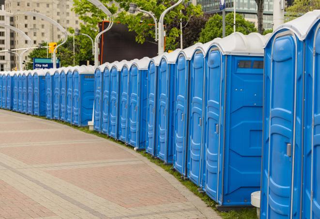 a line of portable restrooms at a sporting event, providing athletes and spectators with clean and accessible facilities in Menlo Park